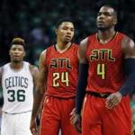 Atlanta Hawks' Kent Bazemore (24) and Paul Millsap (4) walk up court in front of Boston Celtics' Marcus Smart (36) in overtime during game 4 of a first-round NBA basketball playoff series in Boston, Sunday, April, 24, 2016. The Celtics won 104-95. (AP Photo/Michael Dwyer)