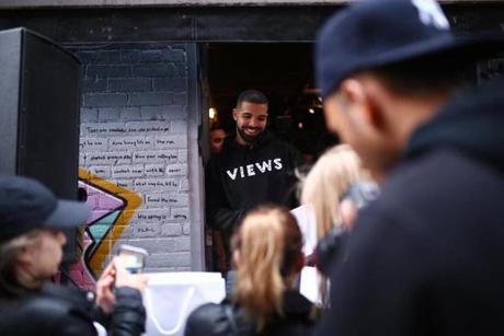 Rapper Drake handed out T-shirts last Sunday as he promoted his new album in Toronto.
