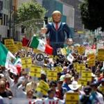 People marched with an inflatable effigy of Republican presidential candidate Donald Trump during an immigrant rights May Day rally in Los Angeles Sunday. 