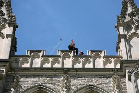 A pocket watch was thrown from the spire of the Williams College chapel; if it breaks, it means good luck for the graduating class.
