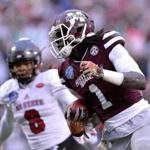 CHARLOTTE, NC - DECEMBER 30: De'Runnya Wilson #1 of the Mississippi State Bulldogs makes a touchdown catch against Dravious Wright #8 of the North Carolina State Wolfpack during the Belk Bowl at Bank of America Stadium on December 30, 2015 in Charlotte, North Carolina. (Photo by Grant Halverson/Getty Images)
