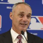 FILE - In this Aug. 13, 2015, file photo, Major League Baseball Commissioner Rob Manfred speaks to members of the media after the owners meetings in Chicago. Manfred will not decide on discipline Jose Reyes until after the domestic violence case involving the Colorado shortstop plays out in court. Speaking on Monday, March 7, 2016, during the Arizona Rockies? exhibition game against the Chicago Cubs, Manfred also said he met with the players? association last week to begin collective bargaining for an agreement to replace the one that expires Dec. 1. (AP Photo/Paul Beaty, File)