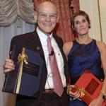 Honorees James Carville and Mary Matalin accept their bound genealogies from NEHGS president and CEO Brenton Simons.
