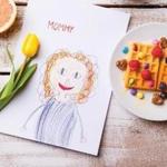 Mothers dayChilds drawing of her mother, yellow tulip, waffles; Shutterstock ID 412471468; PO: living