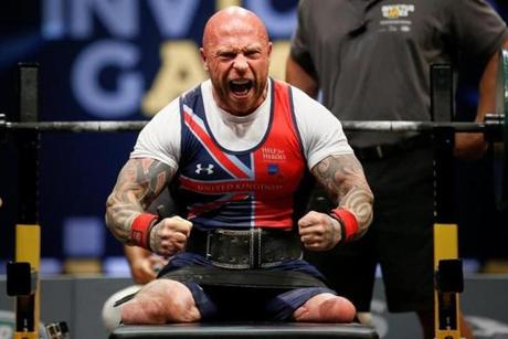 Wounded warrior Michael Yule celebrates after winning the lightweight power lifting gold during the Invictus Games on May 9. 

