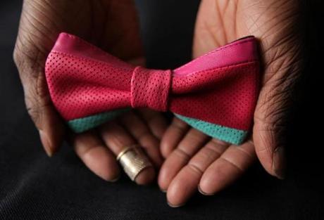 Christopher Chaun Bennett makes high-end bow ties in the bedroom of his apartment.
