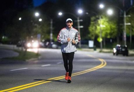 Boston Police Commissioner William Evans trained for the the Maine Coast Marathon by running along William J Day Blvd. in Boston at 4:40 a.m.
