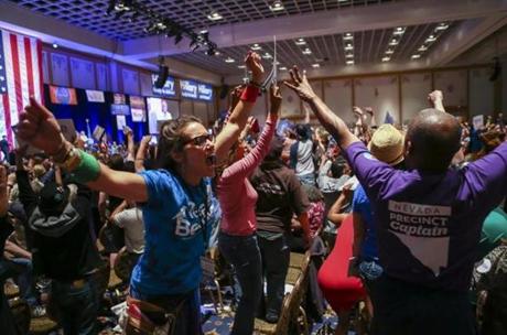 In a Saturday, May 14, 2016 photo, supporters of Democratic presidential candidate Bernie Sanders react during the Nevada State Democratic Party?s 2016 State Convention at the Paris hotel-casino in Las Vegas. The Nevada Democratic Convention turned into an unruly and unpredictable event, after tension with organizers led to some Bernie Sanders supporters throwing chairs and to security clearing the room, organizers said. (Chase Stevens/Las Vegas Review-Journal via AP) LOCAL TELEVISION OUT; LOCAL INTERNET OUT; LAS VEGAS SUN OUT

