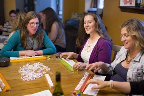 From left: Melissa Landon of Melrose, Hillary Golden of Brookline, and Julie Unger play at Unger?s Melrose home.
