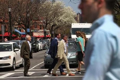 Vehicles and pedestrians made their way down Newbury Street in 2015.
