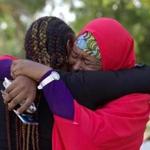 Members of group seeking return of kidnapped women and girls embraced at a demonstration Wednesday in Abuja, Nigeria. 