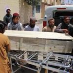 The coffin of one of the victims was carried Sunday. Mullah Mohammed Akhtar Mansour and his driver were killed, Afghan officials claimed.