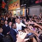 epa05325348 US President Barack Obama (C) shakes hands with local residents as he leaves a restaurant which serves bun cha - a traditional Vietnamese dish of noodle and grilled pork - at a street in Hanoi, Vietnam, 23 May 2016. US President Barack Obama visits Vietnam for the first time from 23 to 25 May 2016, making him the third US President to visit the South East Asian country since the end of the Vietnam War in 1975. EPA/STR