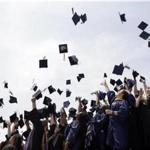 Newly minted local college graduates take part in the annual Toss Your Caps class photo Friday, May 8, 2015, on the steps of the Philadelphia Museum of Art in Philadelphia. (AP Photo/Matt Rourke)