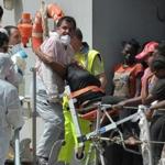 Women rescued in the Mediterranean Sea arrived aboard an Italian navy ship in the port of Reggio Calabria on Sunday.