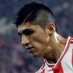 Alan Pulido (left), who plays for the Greek club Olympiakos, was rescued after being kidnapped early Sunday, authorities said.