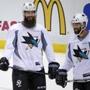 Brent Burns (left) and Patrick Marleau took a break during the Sharks? practice Sunday. 