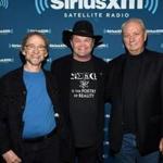 From left to right: Peter Tork, Micky Dolenz, and Michael Nesmith of The Monkees in May.