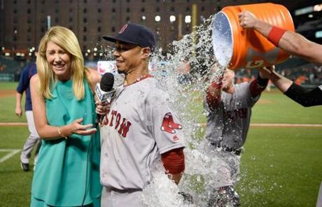 Betts and NESN?s Guerin Austin were doused after the game.
