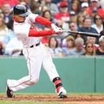 BOSTON, MA - MAY 21: Mookie Betts #50 of the Boston Red Sox hits a home run in the fourth inning during the game against the Cleveland Indians at Fenway Park on May 21, 2016 in Boston, Massachusetts. (Photo by Adam Glanzman/Getty Images)
