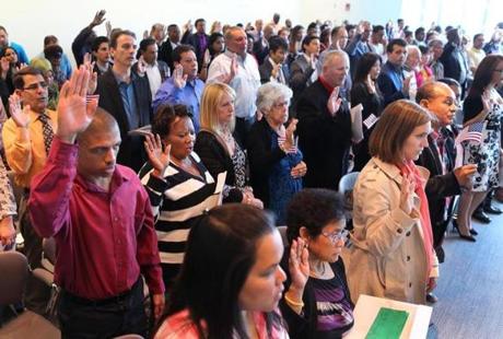 Ninety-eight people were sworn in as naturalized citizens at a ceremony at the Moakley US District Court. 

