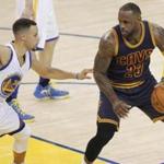 June 2, 2016; Oakland, CA, USA; Cleveland Cavaliers forward LeBron James (23) controls the ball against Golden State Warriors guard Stephen Curry (30) during the first half in game one of the NBA Finals at Oracle Arena. Mandatory Credit: Cary Edmondson-USA TODAY Sports 