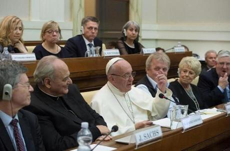 Pope Francis, center, delivered a speech at the Vatican on Saturday. 
