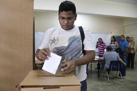 Puerto Rico resident Hector Feliciano voted in San Juan on Sunday.
