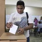 Puerto Rico resident Hector Feliciano voted in San Juan on Sunday.