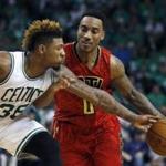 Boston Celtics' Marcus Smart (36) defends against Atlanta Hawks' Jeff Teague (0) during the fourth quarter in game 4 of a first-round NBA basketball playoff series in Boston, Sunday, April, 24, 2016. The Celtics won 104-95 in overtime. (AP Photo/Michael Dwyer)