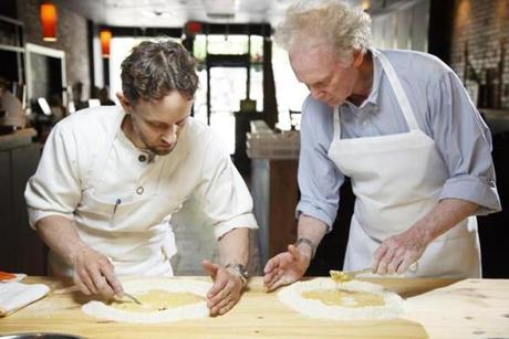 At his Cambridge restaurant, Giulia, Michael Pagliarini (left) teaches Gordon Hamersley how to make pasta from scratch. 
