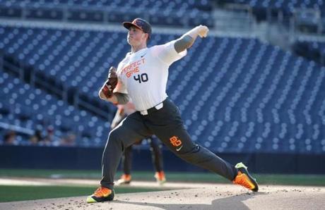 FILE - In this Aug. 16, 2015, file photo, Jason Groome pitches during the Perfect Game All-American Classic high school baseball game, in San Diego. The 17-year-old from Barnegat High School along the New Jersey Shore is 6-foot-5, 225 pounds, throws in the 90s and has a deuce that falls off the table. It's everything baseball scouts want to see, and it's one of the reasons he's considered an early pick in baseball's draft on Thursday night, June 9, 2016. (AP Photo/Lenny Ignelzi, File)
