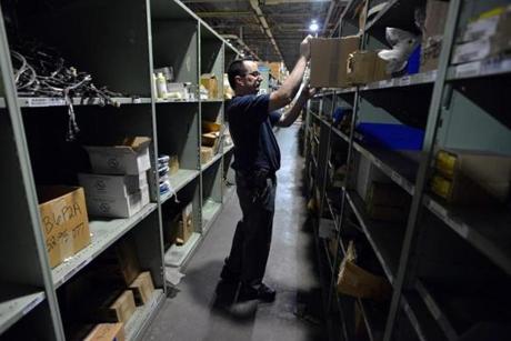 Employee Michael Herman pulled items off shelves at the MBTA Central Warehouse in Everett.

