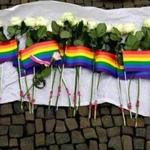 White roses and rainbow flags are displayed in front of the US Embassy in Berlin on June 13, 2016 as people pay tribute to the victims of the Orlando killing. Fifty people died when a gunman allegedly inspired by the Islamic State group opened fire inside a gay nightclub in Florida, in the worst terror attack on US soil since September 11, 2001. / AFP PHOTO / John MACDOUGALLJOHN MACDOUGALL/AFP/Getty Images