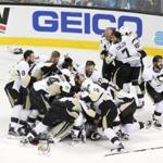 Penguins players mobbed one another after the final horn sounded.