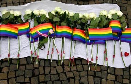 ORLANDO SLIDER 2 White roses and rainbow flags are displayed in front of the US Embassy in Berlin on June 13, 2016 as people pay tribute to the victims of the Orlando killing. Fifty people died when a gunman allegedly inspired by the Islamic State group opened fire inside a gay nightclub in Florida, in the worst terror attack on US soil since September 11, 2001. / AFP PHOTO / John MACDOUGALLJOHN MACDOUGALL/AFP/Getty Images
