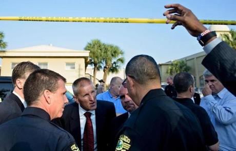 ORLANDO SLIDER 2 Ronald Hopper (3L), FBI Tampa division Assistant Agent in Charge, talks to Orlando Police Chief John Mina (2L), Orlando Police Chief, Paul Wysopal (4L), FBI Tampa Division Special Agent in Charge, and others near the Pulse nightclub June 13, 2016 in Orlando, Florida. Forty-nine people and the shooter died and more than 50 were injured when a gunman opened fire and seized hostages at a gay nightclub in Florida, police said June 12, making it the worst mass shooting in US history. / AFP PHOTO / Brendan SmialowskiBRENDAN SMIALOWSKI/AFP/Getty Images
