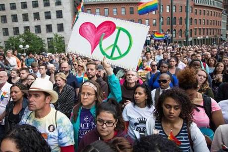 People took part in a vigil at City Hall Plaza in Boston on Monday night.
