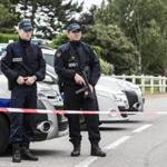 epa05363447 Police officers stand guard at a security perimeter near a house where a French police officer and his wife have been murdered by an assailant allegedly claimed as a ISIS fighter, in Magnanville, near Paris, France, 14 June 2016. The police officer was stabbed outside his house and his partner was killed by the hostage taker, late 13 June 2016. The attacker was killed during the police raid. EPA/CHRISTOPHE PETIT TESSON