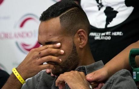 Orlando survivor Angel Colon paused during a press conference.
