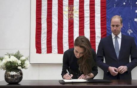 Britain's Prince William and his wife Kate Duchess of Cambridge sign a book of condolences for the victims of the shootings at a gay nightclub in Orlando, at the U.S. Embassy in London, June 14, 2016. REUTERS/Philip Toscano/Pool
