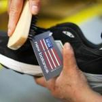 Lawrence-05/2-/15-The New Balance manufacturing factory in Lawrence. A running shoe is brushed in a final step before boxing them. Boston Globe staff photo by John Tlumacki (business)