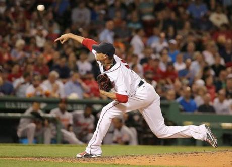 BOSTON, MA - JUNE 16: Clay Buchholz #11 of the Boston Red Sox throws in relief during the seventh inning against the Baltimore Orioles at Fenway Park on June 16, 2016 in Boston, Massachusetts. (Photo by Jim Rogash/Getty Images)
