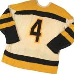 A No. 4 Bruins jersey worn by hard-hitting defenseman Bob Armstrong has sold for nearly $20,000, according to the online auction house Lelands.com.