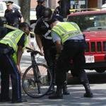 Police lifted the bicycle that was involved in a crash in the Inman Square section of Cambridge.