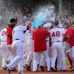 Boston- 6/23/2016 Boston Red Sox vs Chicago White Sox. Red Sox team runs out to 1st base throwing talcum powder and energy drink on Xander Bogaerts who hit a single to win the game. Boston Globe staff photo by John Tlumacki(sports)