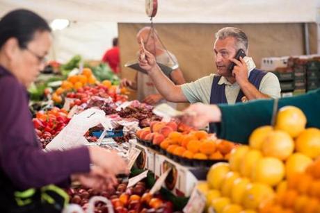 Otto Gallotto, President of the Haymarket Pushcart Association, sells fruit at Haymarket earlier this month.
Aram Boghosian for The Boston Globe 
