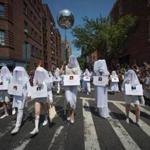 People carrying images of Orlando shooting victims walked during the 46th annual Gay Pride march Sunday in New York. 