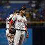 ST. PETERSBURG, FL - JUNE 27: Pitcher Eduardo Rodriguez #52 of the Boston Red Sox is comforted by Xander Bogaerts #2 as he waits for manager John Farrell to take him off the mound during the third inning of a game on June 27, 2016 at Tropicana Field in St. Petersburg, Florida. (Photo by Brian Blanco/Getty Images)