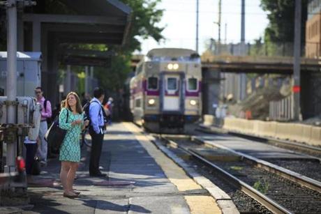 6/20/16 - Chelsea, MA - Commuters boarded an inbound MBTA Commuter Rail train at the Chelsea platform on Monday morning, June 20, 2016. Photo by Dina Rudick/Globe Staff
